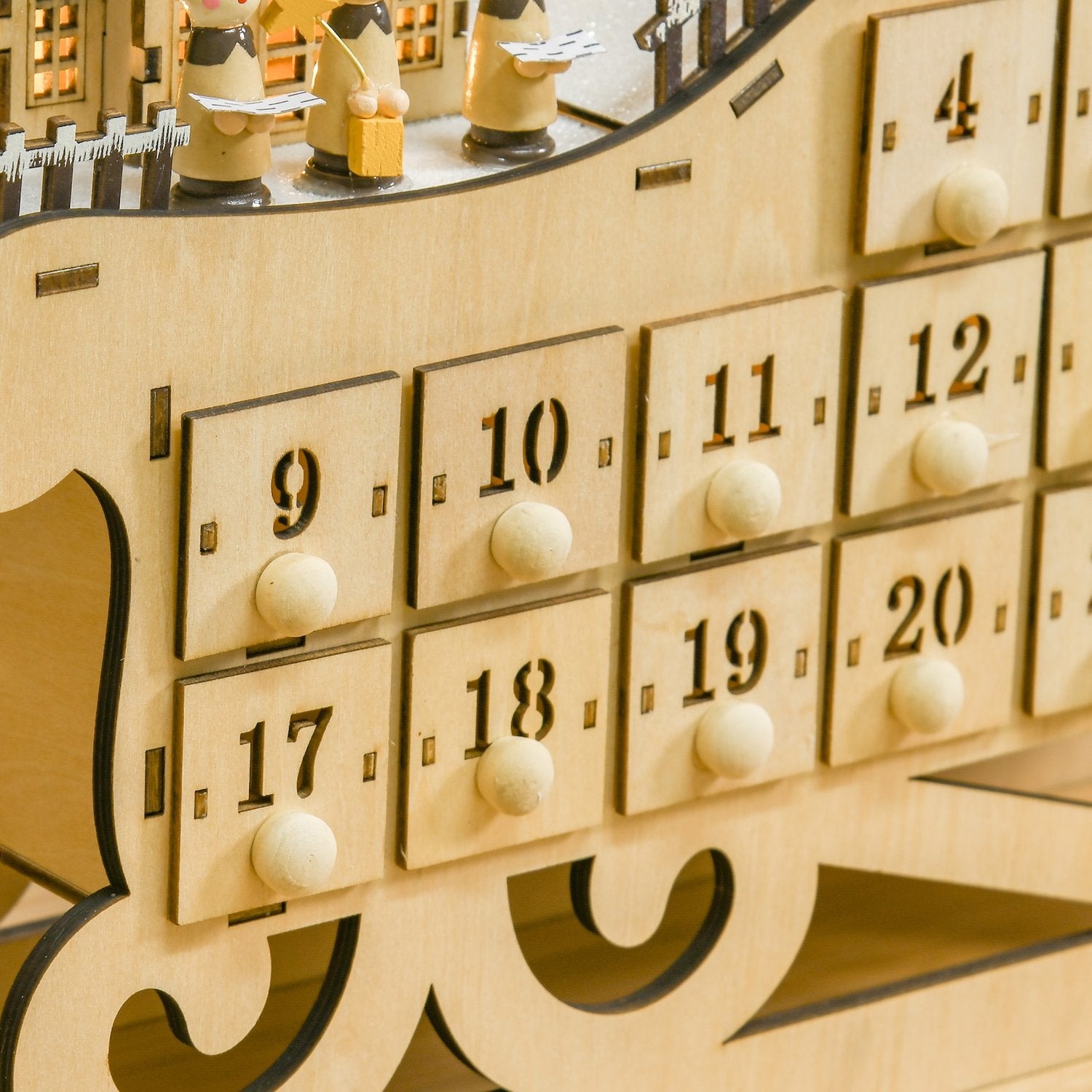 Adventskalender med 24 LED-upplysta lådor, Slädeformad