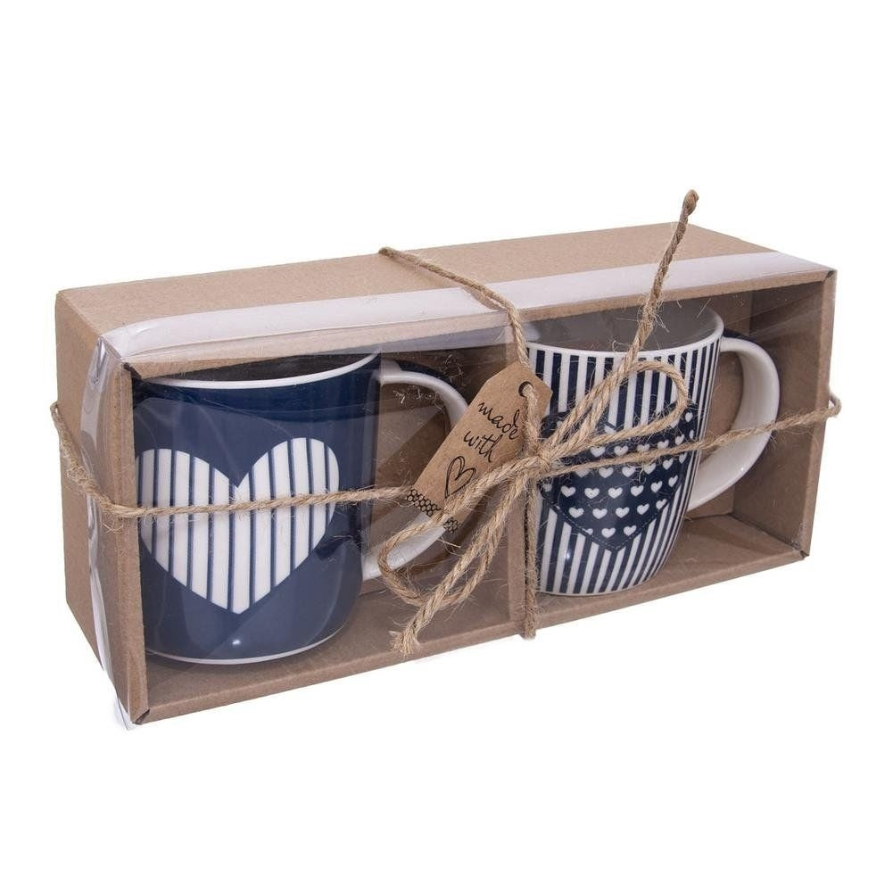 Set med 2 stilrena porslinsmuggar med unik design