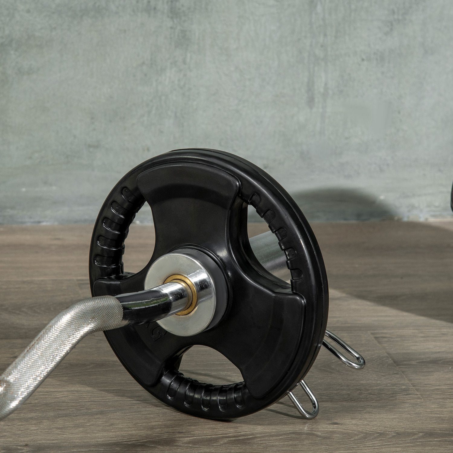 Ett par 5 kg gummi Olympic Tri-Grip viktskivor